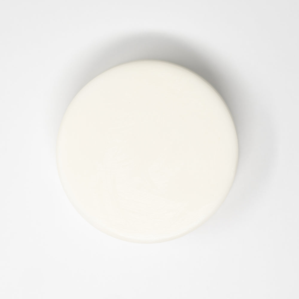 white circular bar of soap